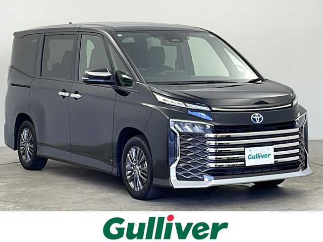 トヨタ ヴォクシー ハイブリッド S－G 千葉県 2022(令4)年 0.8万km グリッターブラックガラスフレーク セーフティセンス/・プリクラッシュセーフティ/・レーントレーシングアシスト/・レーダークルーズコントロール/・ロードサインアシスト/・オートマチックハイビーム/・ドライバー異常時対応システム/・プロアクティブドライビングアシスト/・発進遅れ告知機能/純正8インチディスプレイオーディオ/・Bluetooth接続/・バックカメラ/ユニバーサルステップ/両側パワースライドドア/LEDヘッドライト/AC100V