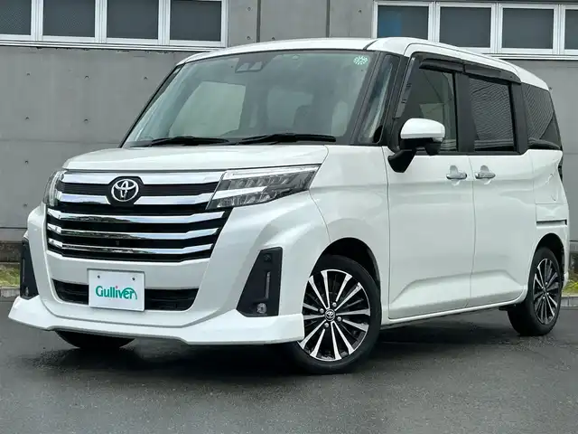 トヨタ ルーミー カスタムG－T 静岡県 2021(令3)年 4.1万km パールホワイトⅢ Toyota Safety Sense/社外9インチメモリーナビ(AVIC-RQ911)/　AM FM CD DVD Bluetooth AUX/ビルトインETC/ドライブレコーダー/LEDオートヘッドライト/デジタルルームミラー/シートヒーター(前席)/LEDルームライト/両側パワースライドドア/ステアリングスイッチ/スマートキー2本/社外充電ポート/フルセグTV/アラウンドビューモニター
