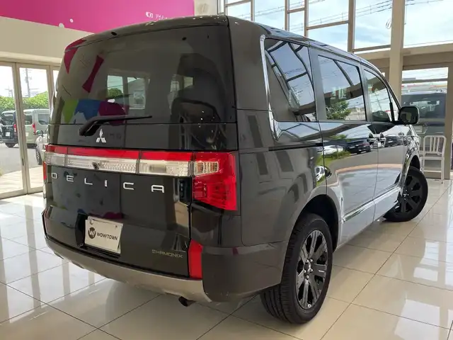 三菱 デリカＤ：５ シャモニー 埼玉県 2025(令7)年 0.1千km 黒Ⅱ e-Assist/11インチナビ/ CD/DVD/BT/USB/HDMI/フルセグ/全方位カメラ/12.8インチ後席モニター/両側電動スライドドア/ハーフレザーシート/パドルシフト/レーダークルーズコントロール/レーンキープアシスト/純正18インチアルミホイール/オートブレーキホールド/スマートキー×2/禁煙車