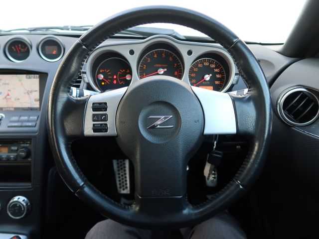 日産 フェアレディ Ｚ 石川県 2007(平19)年 15.3万km ホワイトパール リモコンキー/スペアキー/ステアリングリモコン/純正DVDナビゲーション/バックモニター/HIDライト/電動格納ミラー/純正フロアマット