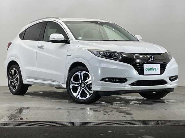ホンダ ヴェゼル ハイブリッド Z ホンダセンシング 栃木県 2018(平30)年 2.5万km ホワイトオーキッドパール 純正ナビ (VXM-184VFi)/(フルセグTV・Bluetooth・CD・DVD)/バックカメラ/ドライブレコーダー/ホンダセンシング/ ・衝突軽減システム/ ・レーンキープアシスト/ ・オートクルーズコントロール/ ・先行車発進告知/ ・リアアクティブフォースペダル/ハーフレザーシート/シートヒーター/電動パーキングブレーキ/オートホールド/ステアリングスイッチ/パドルシフト/純正アルミホイール/純正フロアマット/スマートキー