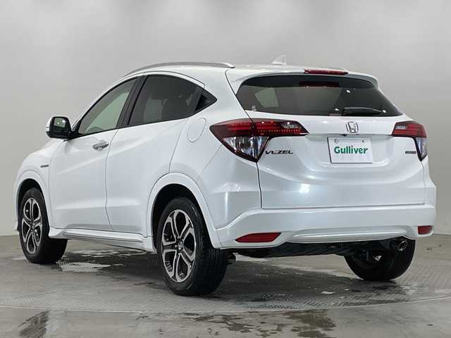 ホンダ ヴェゼル ハイブリッド Z ホンダセンシング 栃木県 2018(平30)年 2.5万km ホワイトオーキッドパール 純正ナビ (VXM-184VFi)/(フルセグTV・Bluetooth・CD・DVD)/バックカメラ/ドライブレコーダー/ホンダセンシング/ ・衝突軽減システム/ ・レーンキープアシスト/ ・オートクルーズコントロール/ ・先行車発進告知/ ・リアアクティブフォースペダル/ハーフレザーシート/シートヒーター/電動パーキングブレーキ/オートホールド/ステアリングスイッチ/パドルシフト/純正アルミホイール/純正フロアマット/スマートキー