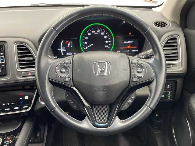 ホンダ ヴェゼル ハイブリッド Z ホンダセンシング 栃木県 2018(平30)年 2.5万km ホワイトオーキッドパール 純正ナビ (VXM-184VFi)/(フルセグTV・Bluetooth・CD・DVD)/バックカメラ/ドライブレコーダー/ホンダセンシング/ ・衝突軽減システム/ ・レーンキープアシスト/ ・オートクルーズコントロール/ ・先行車発進告知/ ・リアアクティブフォースペダル/ハーフレザーシート/シートヒーター/電動パーキングブレーキ/オートホールド/ステアリングスイッチ/パドルシフト/純正アルミホイール/純正フロアマット/スマートキー