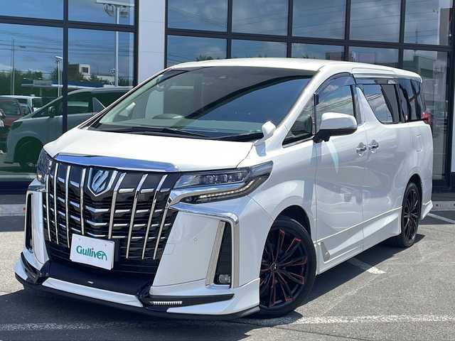 トヨタ アルファードハイブリット SR Cパッケージ 道東・釧路十勝 2021(令3)年 5.5万km ホワイトパールクリスタルシャイン ・寒冷地仕様/・４WD/・ＴＲＤフルエアロ/・アルパイン11インチビッグXナビ/（CD・DVD・BT・SD・ラジオ・USB・HDMI・フルセグ）/・バックカメラ/・アルパインフリップダウンモニター/・両側電動スライドドア/・スマートキー一体型エンジンスターター/・電動リアゲート/・運転席メモリーシート/・運転席・助手席パワーシート/・セカンドシート電動オットマン/・セカンドシート電動リクライニング/・白線逸脱防止機能/・前席エアシート/・ステアリングヒーター/・ＡＣ１００Ｖ（1500W)/・オートハイビーム/・オートブレーキホールド/・MTモード付AT/・社外ドライブレコーダー/・前後コーナーセンサー/・20インチ社外アルミホイール