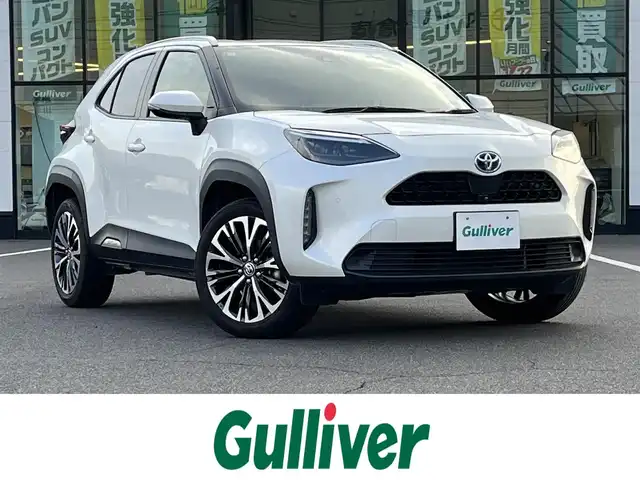 トヨタ ヤリスクロス ハイブリッド Z 岡山県 2021(令3)年 6万km ホワイトパールクリスタルシャイン 登録時走行距離59285km/純正ディスプレイオーディオ/パノラミックビューモニター/パワーバックドア/ビルトインETC/ドライブレコーダー/トヨタセーフティセンス/・ブラインドスポットモニター/・プリクラッシュセーフティ/・オートマチックハイビーム/・レーダークルーズコントロール/横滑り防止装置/オートブレーキホールド/D/N席シートヒーター/ステアリングヒーター/USB入力端子/社外フロアマット/純正18インチAW/社外16インチAW付属