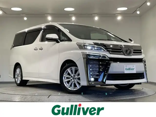 トヨタ ヴェルファイア Z 愛知県 2019(平31)年 7.3万km ホワイトパールクリスタルシャイン ALPINE11incナビ BIGX/CD/DVD/BT/フルセグTV/バックカメラ/ALPINE12.8incフリップダウンモニター/トヨタセーフティーセンス/衝突軽減ブレーキ/車線逸脱警報/標識検知/LEDヘッドライト/オートライト/オートハイビーム/クルーズコントロール/ドライブレコーダー前後（社外）/オートブレーキホールド/電子パーキングブレーキ/横滑り防止/ETC/スマートキー/プッシュスタート