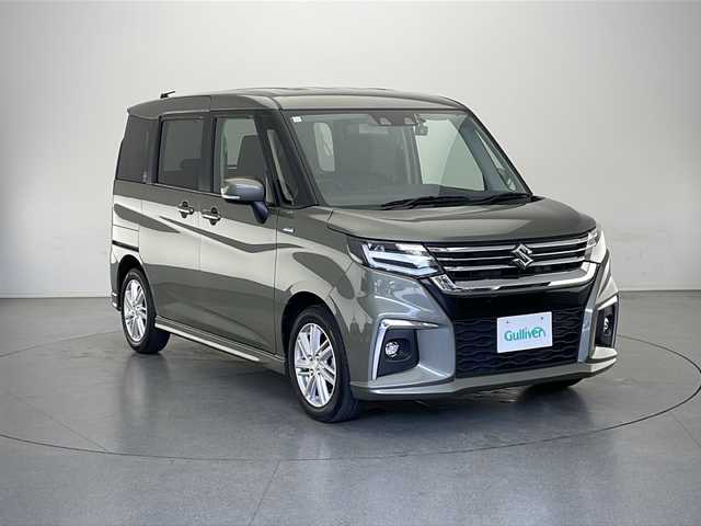 スズキ ソリオ HV MZ 長野県 2023(令5)年 3.6万km タフカーキパールメタリック 社外メモリナビ（型番:CN-E330D)/(ワンセグTV/CD/USB/SD/BL)/社外ドラレコ（前方）/レーダークルーズコントロール/レーンキープアシスト/衝突被害軽減システム/クリアランスソナー/盗難防止装置/オートマチックハイビーム/LEDヘッドライト/フォグランプ/シートヒーター（運転席、助手席）/純正アルミホイール/純正フロアマット/コーナーセンサー（後列）/アイドリングストップ/ウィンカーミラー/スマートキー/スペアキー１本