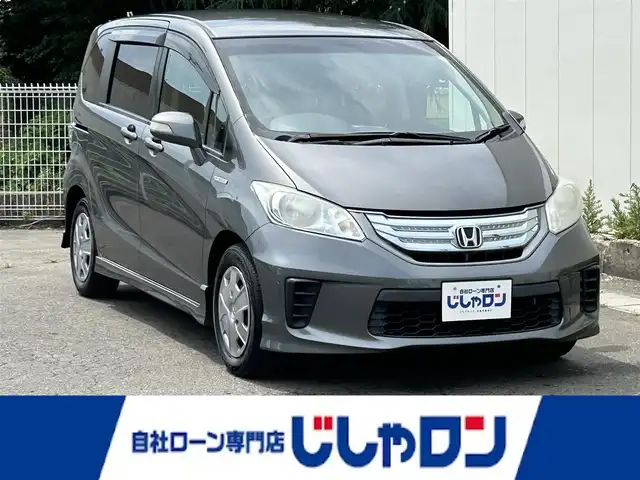 ホンダ フリード ハイブリット ジャストセレクション 福島県 2013(平25)年 11.4万km ポリッシュドメタルメタリック (株)IDOMが運営する【じしゃロン福島店】の自社ローン専用車両になります。こちらは現金またはオートローンご利用時の価格です。自社ローンご希望の方は別途その旨お申付け下さい/ＳＤナビ/フルセグTV/Bluetooth/片側パワースライドドア/ドアバイザー/ETC/３列シート/後席モニター
