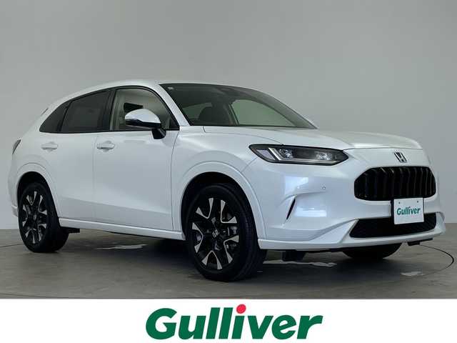 ホンダ ＺＲ－Ｖ ハイブリッド e:HEV Z 鹿児島県 2024(令6)年 3.4万km プラチナホワイトパール 禁煙車/純正ナビ/全方位カメラ/前後ドラレコ/ビルドインETC/BOSEプレミアムサウンド/ホンダセンシング/・衝突軽減ブレーキ/・誤発進抑制機能/・後方誤発進抑制機能/・近距離衝突軽減ブレーキ/・歩行者事故低減ステアリング/・路外逸脱抑制機能/・渋滞追従付アダプティブクルーズコントロール/・トラフィックアラート/・先行車発進のお知らせ/・オートハイビーム/・パーキングセンサー/BSM/ワイヤレス充電/シートヒーター/ステアリングヒーター/電動パーキング/オートホールド/パワーシート/パドルシフト/純正フロアマット/電動リアゲート