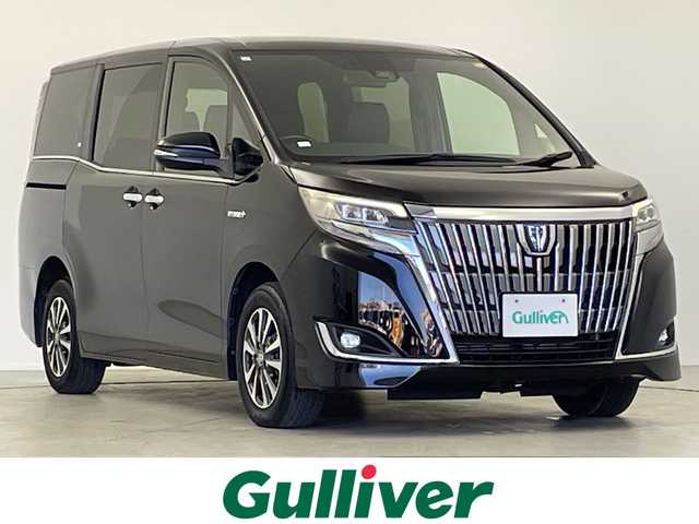 トヨタ エスクァイア ハイブリッド Gi 岐阜県 2019(平31)年 6万km ブラック 純正９インチナビ(NSZT-Y68T)　/フルセグTV　/Bluetooth/両側パワースライドドア　/クルーズコントロール　/シートヒーター　/純正フロアマット　/純正アルミホイール　/セーフティセンス　/オートライト　/ＬＥＤヘッドライト　/スマートキー/オートライト/バックカメラ/ビルトインETC/WAC/シートヒーター/ハンドルヒーター/エンジンスタートボタン/USB入力端子/パワーステアリング/パワーウィンドウ