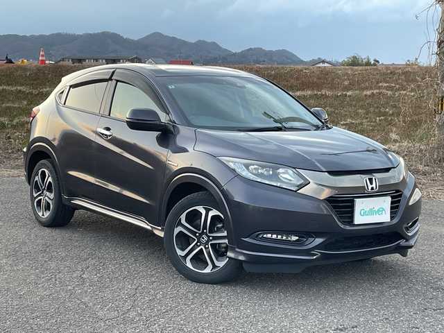 ホンダ ヴェゼル ハイブリッド Z ホンダセンシング 新潟県 2016(平28)年 9.1万km ルーセブラックM 4WD/純正SDナビ(VXM-164VFi)/CD/DVD/BT/フルセグテレビ/バックカメラ/ETC/衝突被害軽減ブレーキ/レーンキープアシスト/レーダークルーズコントロール/半革シート/シートヒーター/パドルシフト/ステアリングスイッチ/スマートキー/プッシュスタート/LEDヘッドライト/オートライト/フォグランプ/純正17インチアルミホイール