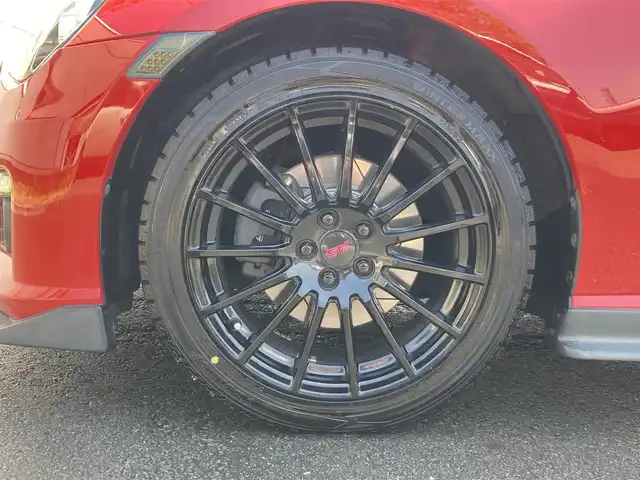 スバル ＢＲＺ プレミアムスポーツパッケージ 静岡県 2014(平26)年 6.8万km ライトニングレッド 社外メモリーナビ(AVIC-MRZ099W)/　AM　FM　CD　DVD　Bluetooth SD /フルセグTV/ETC/スマートキー×２/革巻きステアリング/シートヒーター/STi専用17インチアルミホイール/HIDオートヘッドライト/STiエアロ/６速MT/バックモニター/オレンジ＆ブラックレザーシート