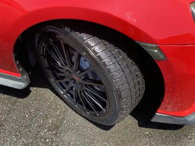 スバル ＢＲＺ プレミアムスポーツパッケージ 静岡県 2014(平26)年 6.8万km ライトニングレッド 社外メモリーナビ(AVIC-MRZ099W)/　AM　FM　CD　DVD　Bluetooth SD /フルセグTV/ETC/スマートキー×２/革巻きステアリング/シートヒーター/STi専用17インチアルミホイール/HIDオートヘッドライト/STiエアロ/６速MT/バックモニター/オレンジ＆ブラックレザーシート