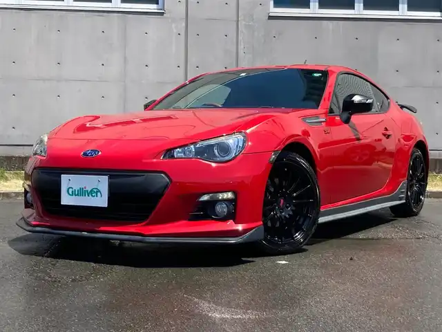 スバル ＢＲＺ プレミアムスポーツパッケージ 静岡県 2014(平26)年 6.8万km ライトニングレッド 社外メモリーナビ(AVIC-MRZ099W)/　AM　FM　CD　DVD　Bluetooth SD /フルセグTV/ETC/スマートキー×２/革巻きステアリング/シートヒーター/STi専用17インチアルミホイール/HIDオートヘッドライト/STiエアロ/６速MT/バックモニター/オレンジ＆ブラックレザーシート