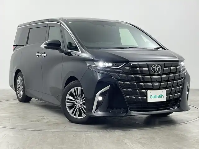 トヨタ アルファードハイブリット Z 群馬県 2024(令6)年 1.4万km ブラック ・トヨタ純正ナビ /・左右独立ムーンルーフ/・パノラミックビュー/・13.2型有機EL後席ディスプレイ/・デジタルインナーミラー/・両側パワースライドドア/・ETC2.0 /・レーダークルーズコントロール/・パワーバックドア/・ステアリングヒーター/・シートヒーター /・トヨタセーフティセンス/・BSM/・PSTA/・PKSB/・SRSエアバッグ（運転席/助手席/サイド/カーテン）/・純正１８インチアルミホイール/・LEDヘッドライト