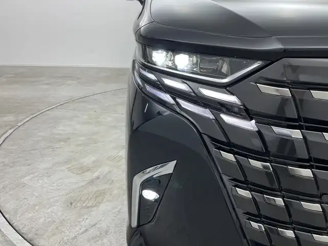 トヨタ アルファードハイブリット Z 群馬県 2024(令6)年 1.4万km ブラック ・トヨタ純正ナビ /・左右独立ムーンルーフ/・パノラミックビュー/・13.2型有機EL後席ディスプレイ/・デジタルインナーミラー/・両側パワースライドドア/・ETC2.0 /・レーダークルーズコントロール/・パワーバックドア/・ステアリングヒーター/・シートヒーター /・トヨタセーフティセンス/・BSM/・PSTA/・PKSB/・SRSエアバッグ（運転席/助手席/サイド/カーテン）/・純正１８インチアルミホイール/・LEDヘッドライト