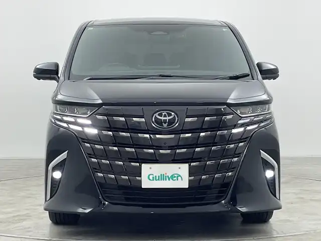 トヨタ アルファードハイブリット Z 群馬県 2024(令6)年 1.4万km ブラック ・トヨタ純正ナビ /・左右独立ムーンルーフ/・パノラミックビュー/・13.2型有機EL後席ディスプレイ/・デジタルインナーミラー/・両側パワースライドドア/・ETC2.0 /・レーダークルーズコントロール/・パワーバックドア/・ステアリングヒーター/・シートヒーター /・トヨタセーフティセンス/・BSM/・PSTA/・PKSB/・SRSエアバッグ（運転席/助手席/サイド/カーテン）/・純正１８インチアルミホイール/・LEDヘッドライト