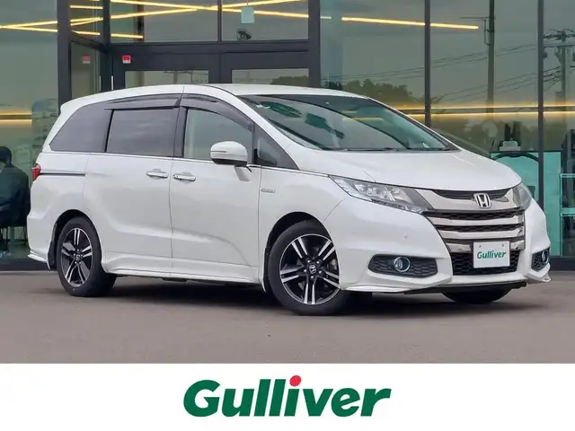 ホンダ オデッセイ ハイブリッド アブソルート ホンダセンシング 東京都 2016(平28)年 3.2万km ホワイトオーキッドパール Honda SENSING/・衝突軽減ブレーキ/・誤発進抑制機能/・歩行者事故低減ステアリング/・路外逸脱抑制機能/・アダプティブクルーズコントロール/・車線維持支援システム/・先行車発進お知らせ機能/・コーナーセンサー/プッシュスタート/純正ナビ/フルセグTV/バックカメラ/ETC/ドライブレコーダー/両側パワースライドドア/ハーフレザーシート/運転席パワーシート/オットマン/後席ロールサンシェード/LEDヘッドライト/ドアバイザー/17インチ純正アルミホイール/スマートキー