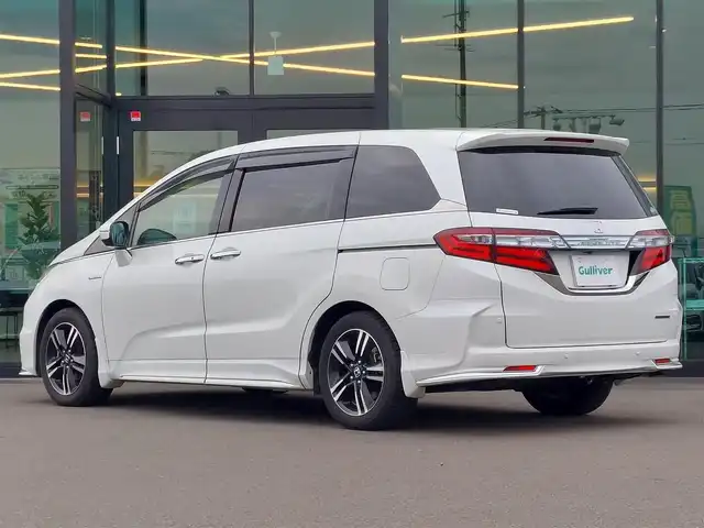 ホンダ オデッセイ ハイブリッド アブソルート ホンダセンシング 東京都 2016(平28)年 3.2万km ホワイトオーキッドパール Honda SENSING/・衝突軽減ブレーキ/・誤発進抑制機能/・歩行者事故低減ステアリング/・路外逸脱抑制機能/・アダプティブクルーズコントロール/・車線維持支援システム/・先行車発進お知らせ機能/・コーナーセンサー/プッシュスタート/純正ナビ/フルセグTV/バックカメラ/ETC/ドライブレコーダー/両側パワースライドドア/ハーフレザーシート/運転席パワーシート/オットマン/後席ロールサンシェード/LEDヘッドライト/ドアバイザー/17インチ純正アルミホイール/スマートキー