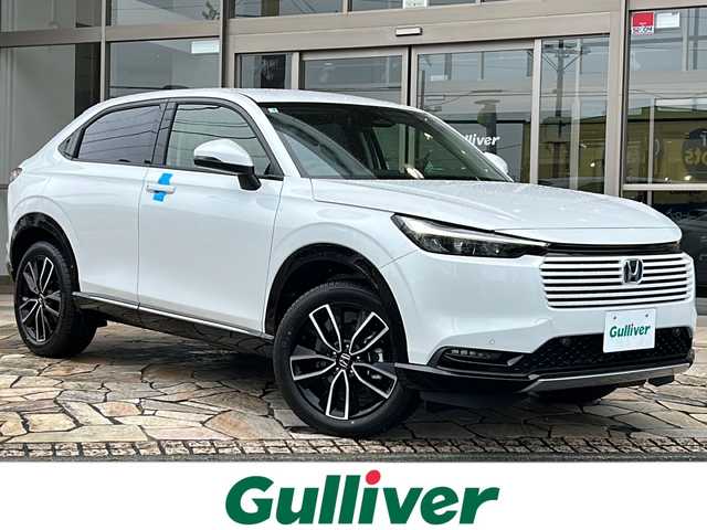 ホンダ ヴェゼル ハイブリッド e:HEV Z 静岡県 2025(令7)年 0.1万km未満 プラチナホワイトパール 【主要装備】/Ｈｏｎｄａ　ＣＯＮＮＥＣＴディスプレー/ＥＴＣ２．０車載器/ワイヤレス充電器　/メモリナビ/バックカメラ　/パワーバックドア　/プッシュスタート　/スマートキー　/純正１８インチアルミホイール　/レーダークルーズコントロール/前席シートヒーター/ハーフレザーシート/アップルカープレイ/アンドロイドオート/レーダークルーズコントロール/プリクラッシュセーフティ/クリアランスソナー