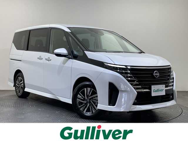 日産 セレナ e－パワー ハイウェイスター V 愛媛県 2025(令7)年 0.1千km プリズムホワイト e-POWER　ハイウエイスターV　ヘッドランプ オートレベライザー+アダプティブLEDヘッドライトシステム+インテリジェント アラウンドビューモニター（移動物 検知機能付）+インテリジェント ルームミラー+アドバンスドドライブアシストディスプレイ（12.3インチカラーディスプレイ）+統合型インターフェースディスプレイ+ワイヤレス充電器+6スピーカー+NissanConnectナビゲーションシステム（地デジ内蔵）+車載通信ユニット（TCU［Telematics Control Unit］）+ETC2.0ユニット（ビルトインタイプ）+ドライブレコーダー（前後セット）+プロパイロット（ナビリンク機能付）+プロパイロット緊急停止支援システム（SOSコール機能付）+SOSコール（488/400円）後席専用モニターHDMI NissanConnectナビ付車用(125/400円)/登録済未使用車　１２．３型ナビ　純正フリップダウンモニター　全周囲カメラ　プロパイロット　インテリジェントルームミラー　ブラインドスポットモニター　両側電動スライドドア　ＥＴＣ　ＬＥＤライト　禁煙