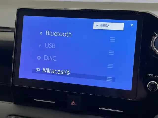 トヨタ ヴォクシー ハイブリッド S－G 愛知県 2023(令5)年 1.8万km ホワイトパールクリスタルシャイン 純正１０．５型ナビ　１４型後席モニター　トヨタチームメイト　禁煙　全方位カメラ　パーキングアシスト　ＢＳＭ　ＤＶＤデッキ　ユニバーサルステップ　電動リアゲート　快適利便Ｍｉｄ　衝突軽減　追従クルコンAC100V電源　クラッツイオシートカバー　LEDオートライト　オートハイビーム　アドバンスドパーク　コーナーセンサー