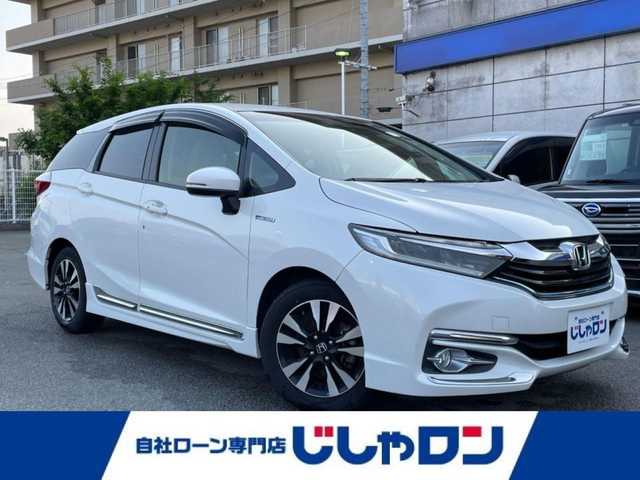 ホンダ シャトル ハイブリッド X スタイルエディション 兵庫県 2016(平28)年 10.1万km ホワイトオーキッドパール (株)IDOMが運営する【じしゃロン姫路店】の自社ローン専用車両になります。こちらは現金またはオートローンご利用時の価格です。自社ローンご希望の方は別途その旨お申付け下さい/純正８型ナビ　/純正ドライブレコーダー　/ステアリングスイッチ　/パドルシフト　/純正ビルトインＥＴＣ　/クルーズコントロール　/オートライト　/ＬＥＤヘッドライト　/フォグライト　/電動格納ミラー　/衝突軽減ブレーキ