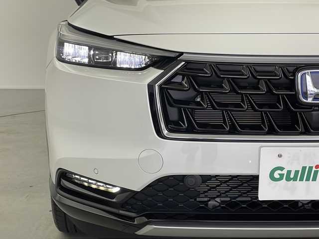 ホンダ ヴェゼル ハイブリッド e:HEV Z 岐阜県 2025(令7)年 0.1万km未満 プラチナホワイトパール Honda CONNECT 9インチディスプレーオーディオ/・ETC2.0車載器+ワイヤレス置くだけ充電器 (220000円)　/・Apple CarPlay/・Android Auto/・Bluetooth/・AM/FM/・USB/・車内WI-FI/フロントグリル　ベルリナブラック (41250円)/革巻きステアリング/・ハンドルヒーター/・ステアリングリモコン/・パドルシフト/スペアキー有/追従型クルーズコントロール/レーンキープアシスト/前後クリアランスソナー/電動パワーバックドア/ハーフレザーシート/・シートヒーター(D席/N席)/衝突軽減ブレーキ/・オートブレーキホールド/LEDヘッドライト/・オートライト/ダウンヒルアシストコントロール