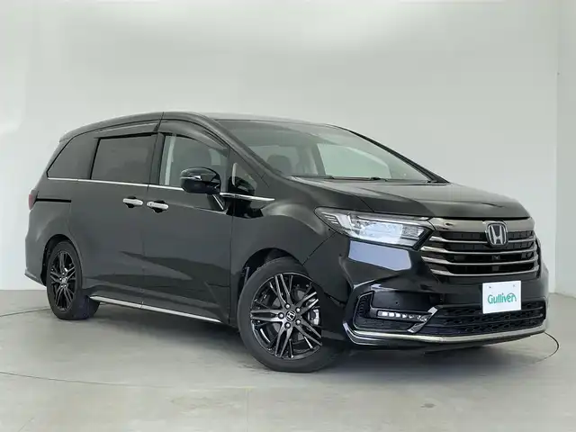 ホンダ オデッセイ ハイブリッド e:HEVアブソルート EX 富山県 2021(令3)年 2.9万km プレミアムスパークルブラックパール 純正11インチナビ/FM/AM/CD/DVD/BT/フルセグTV/後席モニター/全方位カメラ/ACC/パーキングアシスト/ビルトインETC2.0/前後ドライブレコーダー/パワーバックドア/両側パワースライドドア/ハーフレザーシート/パワーシート（D+N席）/シートヒーター（D+N席）/スマートキー/路外逸脱警報機能/衝突被害軽減システム/横滑り防止装置/BSM/コーナーセンサー/電動パーキング/オートブレーキホールド/純正フロアマット/純正18インチAW