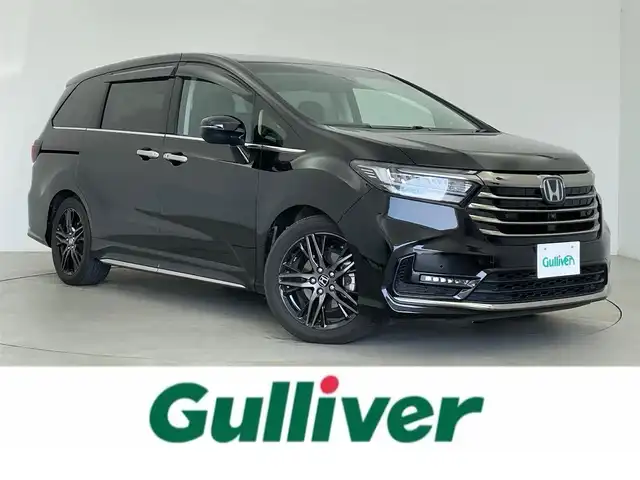 ホンダ オデッセイ ハイブリッド e:HEVアブソルート EX 富山県 2021(令3)年 2.9万km プレミアムスパークルブラックパール 純正11インチナビ/FM/AM/CD/DVD/BT/フルセグTV/後席モニター/全方位カメラ/ACC/パーキングアシスト/ビルトインETC2.0/前後ドライブレコーダー/パワーバックドア/両側パワースライドドア/ハーフレザーシート/パワーシート（D+N席）/シートヒーター（D+N席）/スマートキー/車外逸脱警報機能/衝突被害軽減システム/横滑り防止装置/BSM/コーナーセンサー/電動パーキング/オートブレーキホールド/純正フロアマット/純正18インチAW