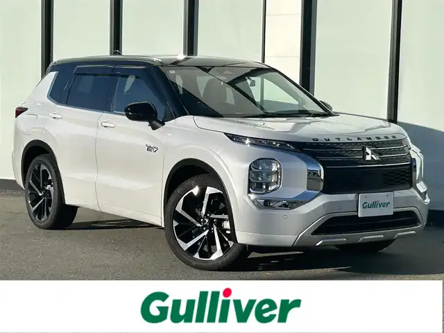 三菱 アウトランダー ＰＨＥＶ P 大阪府 2022(令4)年 1.5万km パールⅡ ＢＯＳＥサウンド　/マイパイロット/純正　インチディスプレイオーディオ　/   ＴＶ/Bluetooth/USB/100V電源　/衝突軽減ブレーキ/クリアランスソナー　/全方位モニター　/ブラインドスポットモニター/レーダークルーズコントロール/レーンキープアシスト/アイドリングストップ　/シートヒーター（1列目、2列目）　/電動リアゲート/前席パワーシート（運転席メモリー付き）/前後ドライブレコーダー　/ワイヤレス充電/レザーシート/純正フロアマット/プッシュスタート/スマートキー　/ＥＴＣ　/ＬＥＤ