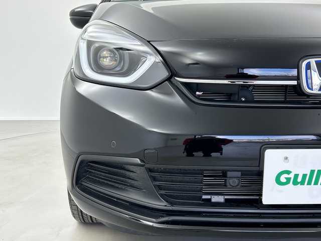 ホンダ フィット e:HEVホーム 奈良県 2024(令6)年 1.2万km クリスタルブラックパール 純正ギャザーズ9インチナビ/フルセグ CD DVD BT MSV USB/バックカメラ/ビルトインETC/レーダークルーズコントロール/衝突軽減ブレーキ/踏み間違い/パーキングセンサー/レーンキープアシスト/電子パーキング/BREAK HOLD/純正ギャザーズドライブレコーダー/ハーフレザーシート/LEDヘッドライト/オートライト/オートハイビーム/スマートキー/純正ドアバイザー/純正フロアマット/電動格納ミラー