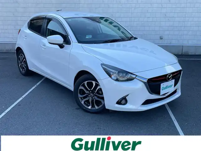 マツダ デミオ XD ツーリング 静岡県 2015(平27)年 5.2万km スノーフレイクホワイトパールマイカ ディーゼルターボ車/純正ナビ/（AM/FM/BT/USB）/バックカメラ/クルーズコントロール/ヘッドアップディスプレイ/スマートキー/プッシュスタート/パドルシフト/LEDヘッドライト/純正16インチアルミホイール/純正フロアマット/横滑り防止装置/電格ミラー/取扱説明書/保証書