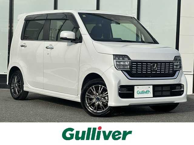 ホンダ Ｎ ＷＧＮ カスタム L ホンダセンシング 山形県 2020(令2)年 0.6万km プラチナホワイトパール ４WD/レーダークルーズコントロール/電動パーキングブレーキ/純正メモリナビ/（AM/FM/フルセグ/Bluetooth）/LEDヘッドライト/純正ホイールサマータイヤ車載/155/65/R14（６ｍｍ）/横滑り防止装置/ドアバイザー/電動格納ミラー/DN席シートヒーター/ビルトインETC/スマートキー/純正アルミホイール/純正フロアマット/レーンキープアシスト/横滑り防止装置/ドアバイザー/電動格納ミラー