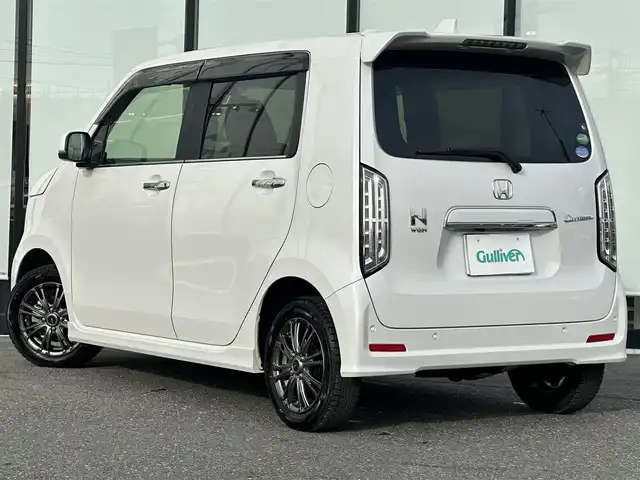 ホンダ Ｎ ＷＧＮ カスタム L ホンダセンシング 山形県 2020(令2)年 0.6万km プラチナホワイトパール ４WD/レーダークルーズコントロール/電動パーキングブレーキ/純正メモリナビ/（AM/FM/フルセグ/Bluetooth）/LEDヘッドライト/純正ホイールサマータイヤ車載/155/65/R14（６ｍｍ）/横滑り防止装置/ドアバイザー/電動格納ミラー/DN席シートヒーター/ビルトインETC/スマートキー/純正アルミホイール/純正フロアマット/レーンキープアシスト/横滑り防止装置/ドアバイザー/電動格納ミラー