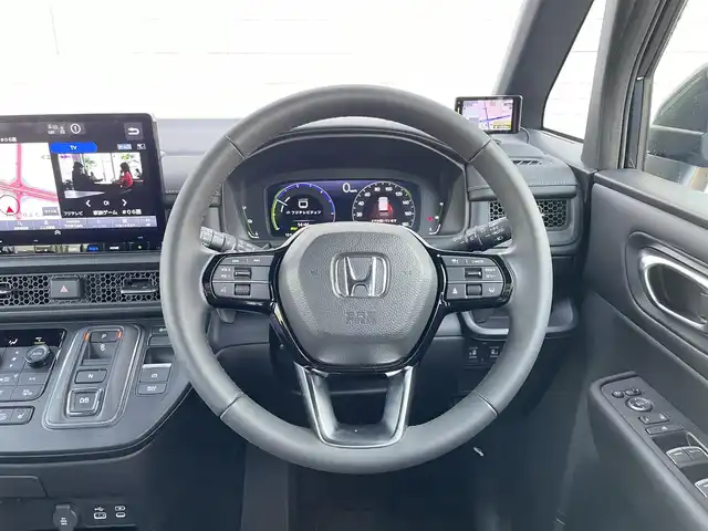 ホンダ ステップワゴン スパーダ eHEV 群馬県 2023(令5)年 2.9万km ミッドナイトブルービームM ホンダセンシング/・衝突軽減ブレーキ/・誤発進抑制機能/・後方誤発進抑制機能/・近距離衝突軽減ブレーキ/・歩行者事故低減ステアリング/・路外逸脱抑制機能/・渋滞追従機能付アダプティブクルーズコントロール/・車線維持支援システム/・トラフィックジャムアシスト/・先行車発進お知らせ機能/・標識認識機能/・オートハイビーム/・ブラインドスポットインフォメーション/フルセグTV/社外フリップダウンミニター/バックカメラ/ハーフレザー/シートヒーター（D席/N席）/レーダークルコン/パドルシフト/両側パワースライド/前後ドラレコ/社外GPSレーダー/パワーバックドア/LEDヘッドライト/純正AW/純正フロアマット