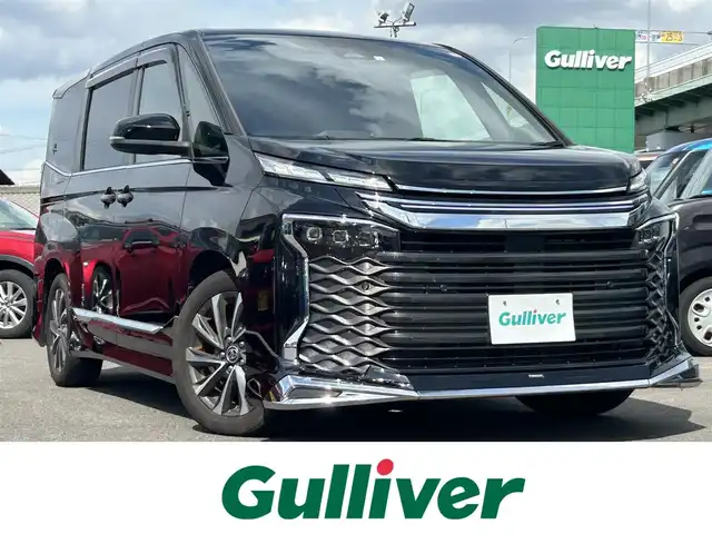 トヨタ ヴォクシー ハイブリッド S－Z 愛知県 2023(令5)年 4.2万km アティチュードブラックマイカ コネクテッドナビ９インチ/純正リアモニター１４インチ/ＤＴＶ/ＢＴ/ＣＤ／ＤＶＤ/ＥＴＣ/両側パワースライドドア/パワーバックドア/純正フロアマット/ドアバイザー/モデリスタエアロＦ・Ｓ・Ｒ/オットマン/ブラインドスポットモニター/レーダークルーズコントロール/衝突軽減ブレーキ/ＡＣ１００Ｖ/ステアリングスイッチ/ハーフレザー