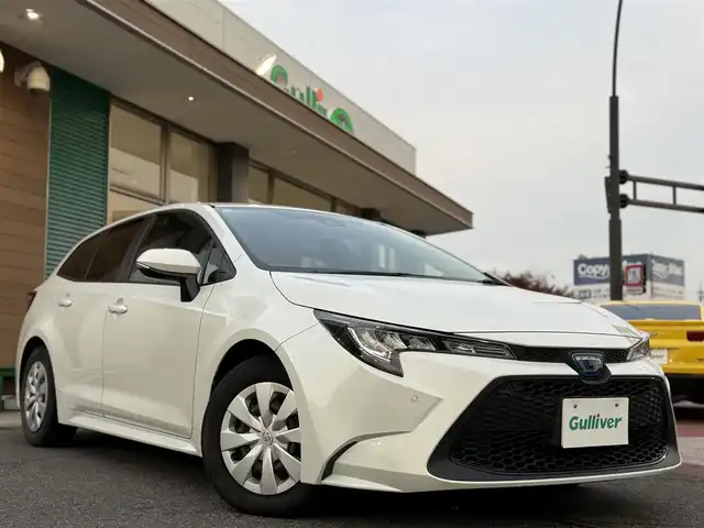 トヨタ カローラツーリング ハイブリッド G－X プラス 香川県 2021(令3)年 9.4万km ホワイトパールクリスタルシャイン ワンオーナー/ディスプレイオーディオナビ/フルセグ/バックカメラ/セーフティセンス/レーダークルーズ/オートハイビーム/レーンキープ/LEDヘッドライト/スマートキー/ビルトインETC