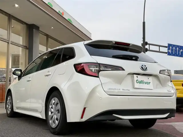 トヨタ カローラツーリング ハイブリッド G－X プラス 香川県 2021(令3)年 9.4万km ホワイトパールクリスタルシャイン ワンオーナー/ディスプレイオーディオナビ/フルセグ/バックカメラ/セーフティセンス/レーダークルーズ/オートハイビーム/レーンキープ/LEDヘッドライト/スマートキー/ビルトインETC