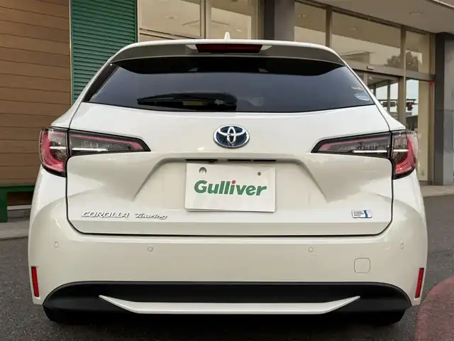 トヨタ カローラツーリング ハイブリッド G－X プラス 香川県 2021(令3)年 9.4万km ホワイトパールクリスタルシャイン ワンオーナー/ディスプレイオーディオナビ/フルセグ/バックカメラ/セーフティセンス/レーダークルーズ/オートハイビーム/レーンキープ/LEDヘッドライト/スマートキー/ビルトインETC