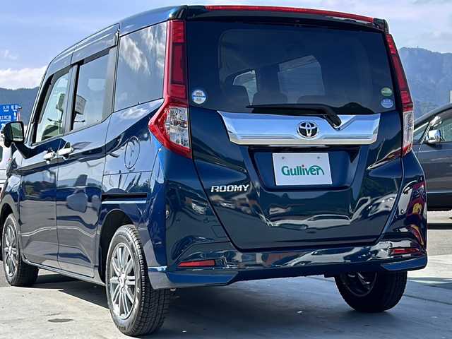 トヨタ ルーミー カスタムG－T 山梨県 2019(令1)年 1.6万km レーザーブルークリスタルシャイン 純正7インチナビ/Bluetooth接続/バックカメラ/衝突被害軽減システム/クルーズコントロール/両側パワースライドドア/ハンズフリーオートスライドドア/横滑り防止装置/純正ETC/ドライブレコーダー/アイドリングストップ/LEDヘッドライト/オートライト/オートハイビーム/社外14インチAW/純正AW付サマータイヤ/プッシュスタート/スマートキー/純正フロアマット/スペアキー/取扱説明書/保証書