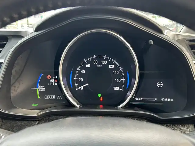 ホンダ フィット ハイブリット L ホンダセンシング 鳥取県 2019(平31)年 3.2万km シャイニンググレーM 純正ナビ/BT/CD/USB/バックカメラ・ETC/ホンダセンシング/レーダークルーズコントロール/レーンキープアシスト/ハーフレザーシート/LEDヘッドライト/フォグライト/アイドリングストップ/ドアバイザー/プッシュエンジンスタート/スペアキー/取扱説明書
