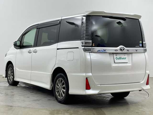 トヨタ ヴォクシー ZS 煌 道央・札幌 2018(平30)年 4.8万km ホワイトパールクリスタルシャイン ・4WD/寒冷地仕様/・トヨタセーフティセンス/・プリクラッシュセーフティ/・純正9インチナビ/・BT/DVD/CD/フルセグ/SD/・バックカメラ/・両側パワースライドドア/・LEDオートライト/フォグランプ/・オートマチックハイビーム/・スマートキー×2/プッシュスタート/・純正ドライブレコーダー/・アイドリングストップ/・車線逸脱防止警報/・ETC/・夏タイヤ純正AW積込