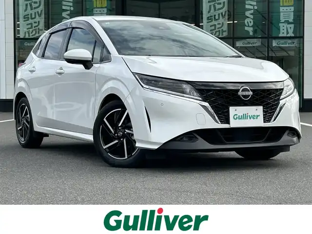 日産 ノート X 岡山県 2021(令3)年 0.4万km 白 登録時走行距離3883km/純正9インチナビ/（AM.FM.BT.フルセグ.HDMI）/インテリジェントエマージェンシーブレーキ/・被害軽減（自動）ブレーキ（対車両、歩行者）/・ペダル踏み間違い時加速抑制装置（前方）/・車線逸脱警報装置/・先進ライト/パノラミックビューモニター/デジタルインナーミラー/ワイヤレス充電/ドライブレコーダー/LEDヘッドライト/ETC2.0