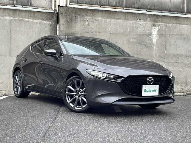 マツダ マツダ３ファストバック XD バーガンディセレクション 愛知県 2021(令3)年 1.6万km マシーングレープレミアムM ワンオーナー/BOSEサウンドシステム/レザーシート(赤革)/純正ナビ/フルセグTV・CD・DVD・SD・Bluetooth/３６０°セーフティパッケージ/３６０°ビュー・モニター＋ドライバー・モニタリング/運転席パワーシート/運転席シートメモリー機能付きパワーシート/ステアリングヒーター/前席シートヒーター/ヘッドアップディスプレイ/レーダークルーズコントロール/クリアランスソナー/ブラインドスポットモニター/オートブレーキホールド/パドルシフト/ビルトインＥＴＣ/アイドリングストップ/ステアリングスイッチ/オートライト/LEDヘッドライト/横滑り防止機能/純正フロアマット/ISOFIX/スマートキー/スペアスマートキー/保証書/ディーラー点検整備記録簿R4 R5 R6/取扱説明書