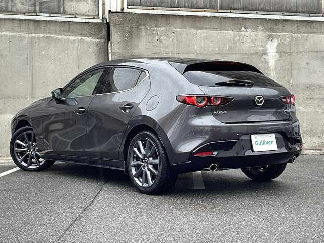 マツダ マツダ３ファストバック XD バーガンディセレクション 愛知県 2021(令3)年 1.6万km マシーングレープレミアムM ワンオーナー/BOSEサウンドシステム/レザーシート(赤革)/純正ナビ/フルセグTV・CD・DVD・SD・Bluetooth/３６０°セーフティパッケージ/３６０°ビュー・モニター＋ドライバー・モニタリング/運転席パワーシート/運転席シートメモリー機能付きパワーシート/ステアリングヒーター/前席シートヒーター/ヘッドアップディスプレイ/レーダークルーズコントロール/クリアランスソナー/ブラインドスポットモニター/オートブレーキホールド/パドルシフト/ビルトインＥＴＣ/アイドリングストップ/ステアリングスイッチ/オートライト/LEDヘッドライト/横滑り防止機能/純正フロアマット/ISOFIX/スマートキー/スペアスマートキー/保証書/ディーラー点検整備記録簿R4 R5 R6/取扱説明書