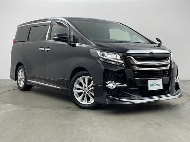 トヨタ アルファード S Cパッケージ 兵庫県 2017(平29)年 3.4万km ブラック ・アルパイン11インチナビ/Bluetooth/CD/DVD/SD/USB/テレビ/・バックカメラ/・アルパイン12.8インチリアフリップダウンモニター/・クルーズコントロール/・ドライブスタートコントロール/・純正ウッドコンビステアリング/・エグゼクティブシート/・クリアランスソナー/・イモビライザーシステム/・電子パーキングブレーキ/・オートホールド/・MTモード付AT/・ステアリングスイッチ/・ステアリングヒーター/・両側パワースライドドア/・パワーバックドア/・ハーフレザーシート/・全席パワーシート（運転席メモリー付き）/・オットマン/・社外フロアマット/・nanoe/・LEDヘッドライト/・純正規格外18インチアルミホイールタイヤ/・モデリスタエアロ/・モデリスタフロントグリル/・ビルトインETC/・プッシュスタートボタン/・スマートキー