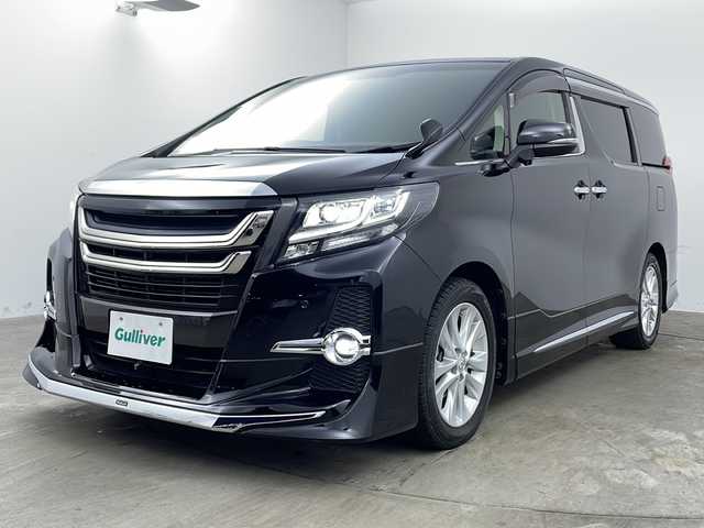 トヨタ アルファード S Cパッケージ 兵庫県 2017(平29)年 3.4万km ブラック ・アルパイン11インチナビ/Bluetooth/CD/DVD/SD/USB/テレビ/・バックカメラ/・アルパイン12.8インチリアフリップダウンモニター/・クルーズコントロール/・ドライブスタートコントロール/・純正ウッドコンビステアリング/・エグゼクティブシート/・クリアランスソナー/・イモビライザーシステム/・電子パーキングブレーキ/・オートホールド/・MTモード付AT/・ステアリングスイッチ/・ステアリングヒーター/・両側パワースライドドア/・パワーバックドア/・ハーフレザーシート/・全席パワーシート（運転席メモリー付き）/・オットマン/・社外フロアマット/・nanoe/・LEDヘッドライト/・純正規格外18インチアルミホイールタイヤ/・モデリスタエアロ/・モデリスタフロントグリル/・ビルトインETC/・プッシュスタートボタン/・スマートキー