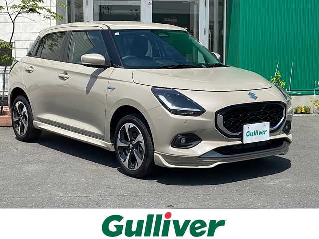 スズキ スイフト HYBRID MZ 青森県 2023(令5)年 0.5万km キャラバンアイボリーPM 4WD/純正9インチディスプレイオーディオ/USB・BT・AppleCarPlay・androidAuto/スズキセーフティサポート/デュアルセンサーブレーキサポート/追従クルーズコントロール/リアクロストラフィックアラート/レーンキープアシスト/アダプティブハイビーム/ブラインドスポットモニター/前席シートヒーター/ワイヤレス充電器/パドルシフト/ステアリングスイッチ/LEDヘッドライト/LEDフォグランプ/純正16インチアルミホイール/純正フロントスポイラー/スマートキー/プッシュスタート