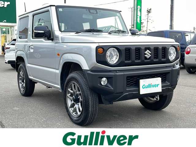 スズキ ジムニー XC 道東・釧路十勝 2024(令6)年 2.8万km シルキーシルバーメタリック 4WD/ナビ　MDV-D311W/(AM/FM/CD/DVD/BT)/ドライブレコーダー 前のみ/ETC/バックカメラ/シートヒーター　前席/純正16インチAW/社外フロアマット/背面タイヤ/ヘッドライトウォッシャー/フォグランプ/アイドリングストップ/クルーズコントロール 追従なし/コーナーセンサー　前後/レーンキープアシスト/ダウンヒルアシスト/オートライト/ライトレベライザー/盗難防止装置/ABS/横滑り防止装置